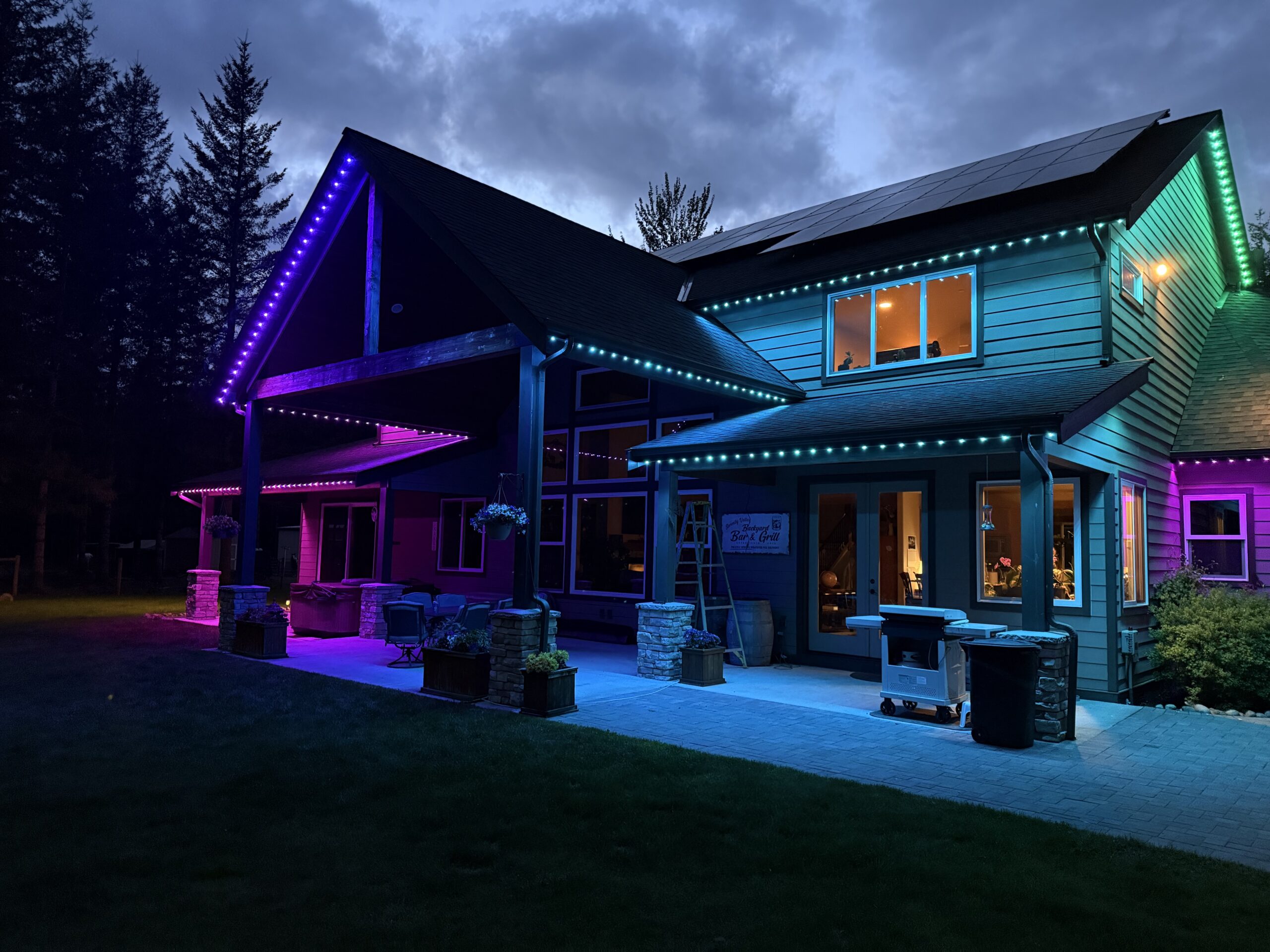 House with LED permanent outdoor lighting at night